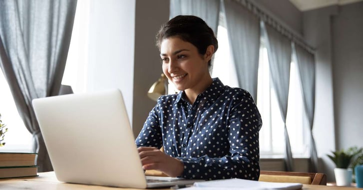 Woman typing on laptop