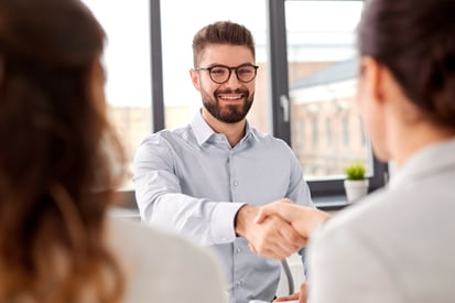 Two professionals shaking hands