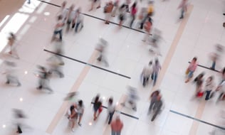 image of people walking through a busy shopping centre