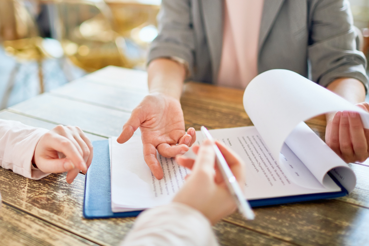 person signing a contract
