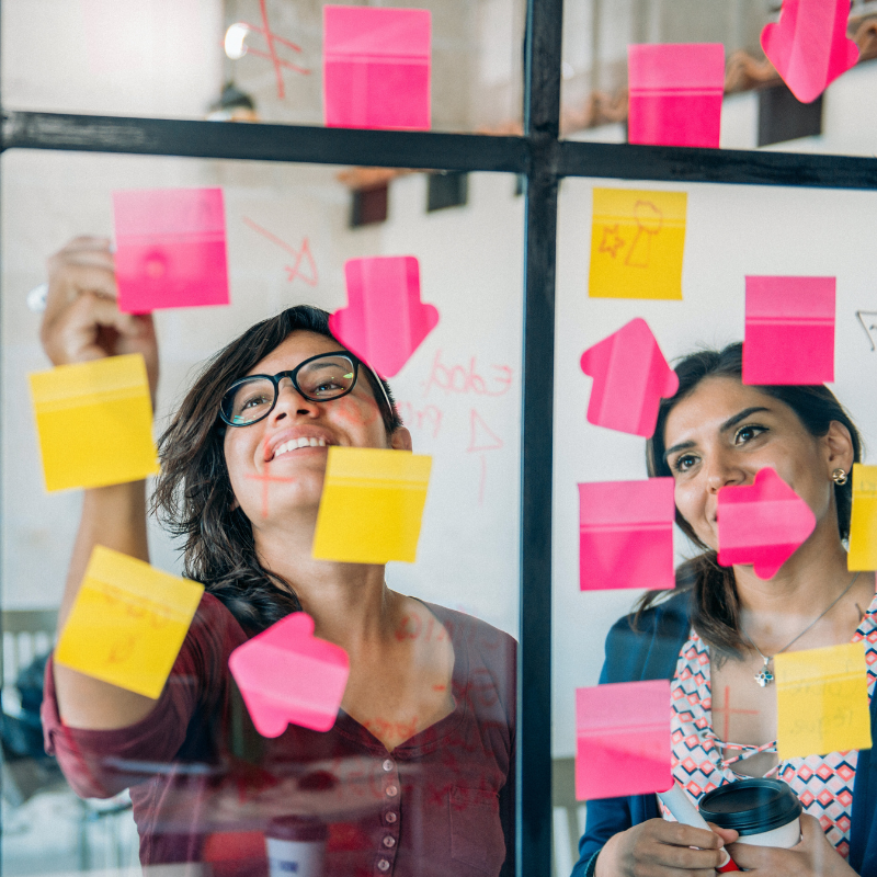 team of two women brainstorming