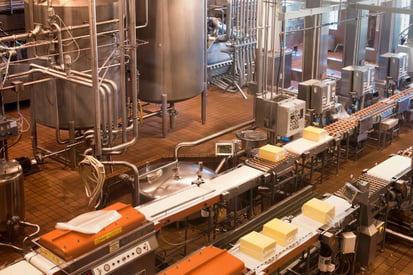 Factory setting with conveyor belts and tanks