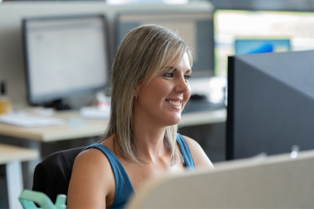 woman looking at computer in office setting