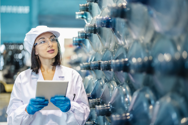 woman doing a quality check at a water warehouse
