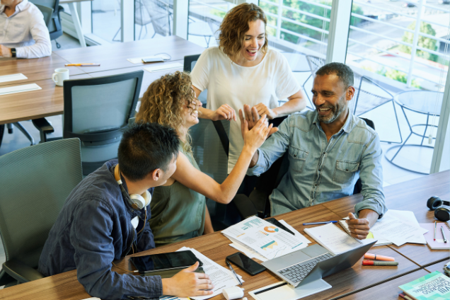 Team collaborating around a table in a modern office