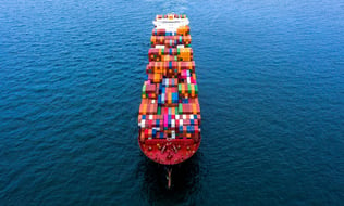 ship at sea with containers 