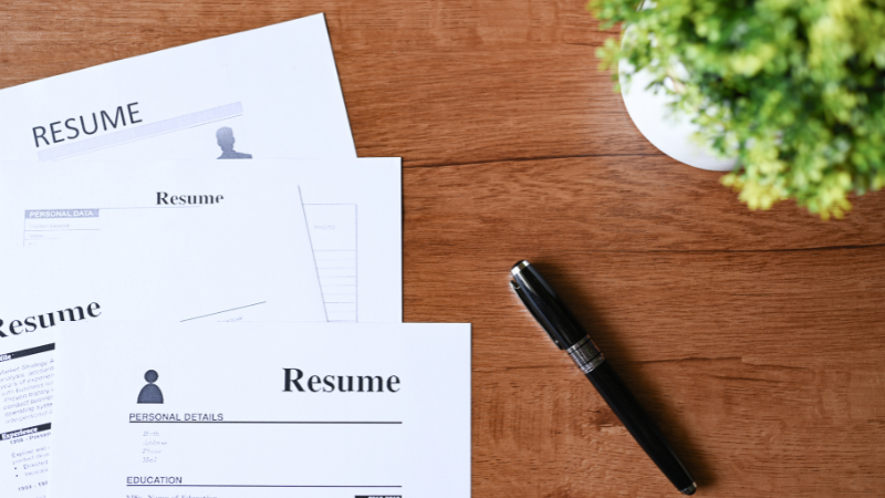 image of a few resumes on a table