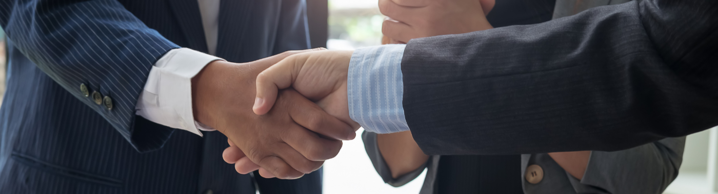 picture of two men checking hands