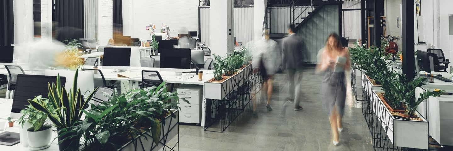 image of people walking inside a workplace