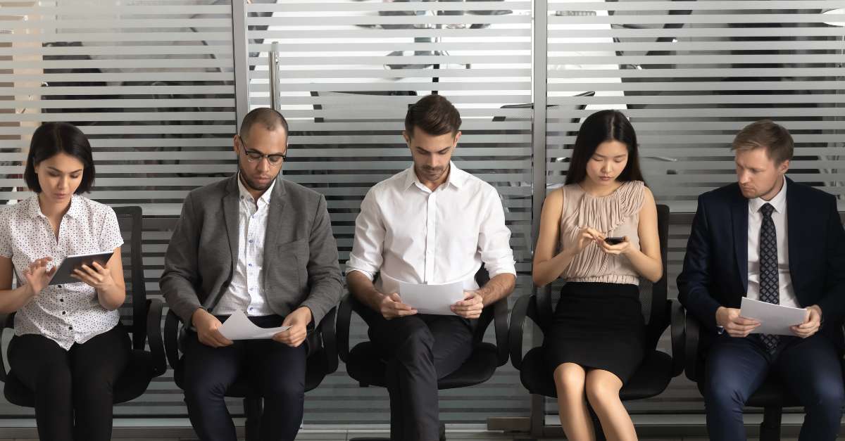 Diverse professionals sitting in waiting room