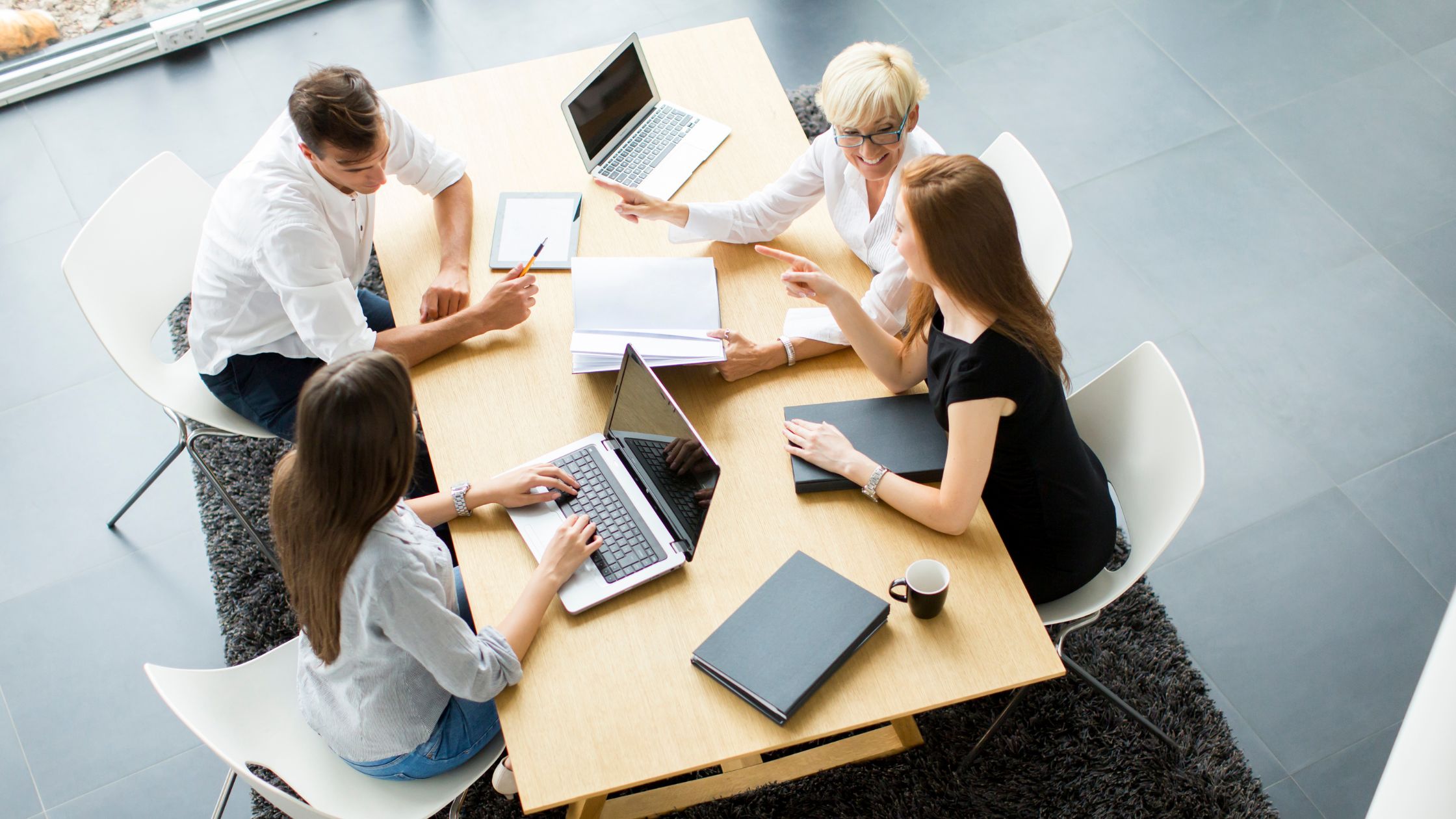 image of a people working on laptops 