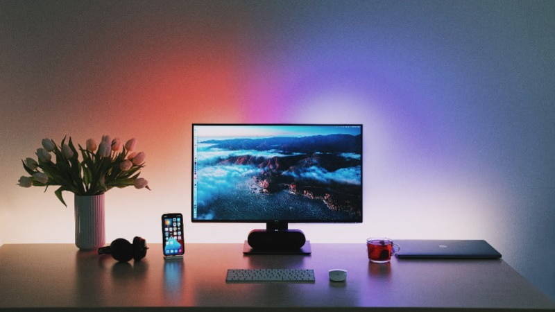 working from home with a desktop computer and phone