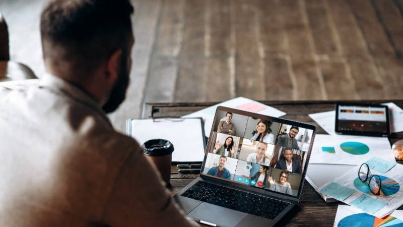 man on a video call on laptop